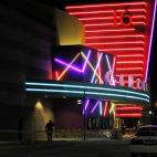 Police are pictured outside of a Century 16 movie theatre where as many as 12 people were killed and many injured at a shooting during the showing of a movie at the in Aurora, Colo., Friday, July 20, 2012. (Photo credit: AP Photo/Ed Andrieski)