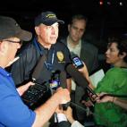 Aurora Police Chief Daniel Oates talks to media at the Aurora Mall where as many as 14 people were killed and many injured at a shooting at the Century 16 movie theatre in Aurora, Colo., Friday, July 20, 2012. (Photo credit: AP Photo/Ed Andrieski)