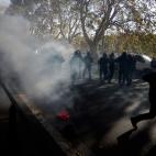 Riot policemen run after demonstrators during a protest on a day of mobilisation against austerity measures by workers in southern Europe on November 14, 2012 in Rome. Riot police and anti-austerity protesters clashed in Italy on Wednesday as an...