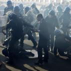 Demonstrators and riot policemen fight during a protest on a day of mobilisation against austerity measures by workers in southern Europe on November 14, 2012 in Rome. Riot police and anti-austerity protesters clashed in Italy on Wednesday as an...