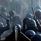 Riot policemen fight with demonstrators during a protest on a day of mobilisation against austerity measures by workers in southern Europe on November 14, 2012 in Rome. Riot police and anti-austerity protesters clashed in Italy on Wednesday as a...