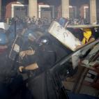 Police clash with demonstrators during a protest against Italian Government austerity measures in Rome, Wednesday, Nov. 14, 2012. Workers across the European Union sought to present a united front against rampant unemployment and government spen...