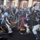 Police clash with demonstrators during a protest against Italian Government austerity measures in Rome, Wednesday, Nov. 14, 2012. Workers across the European Union sought to present a united front against rampant unemployment and government spen...