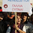 French people living in Greece shout slogans and hold a banner that reads in Greek and French: ''France Wake Up'' outside the Greek parliament during a protest in Athens, Wednesday, Nov. 14, 2012. Workers across the European Union sought to pres...