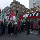 A bus passes as protesters block traffic on one side of Oxford Street, London, whilst taking part in a picket and demonstration they said was over dismissals of 28 workers employed by contractors on the Crossrail transport project, for being tra...