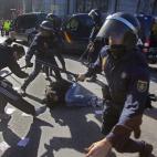 Police clash with protestors during a general strike in Madrid, Spain, Wednesday, Nov. 14, 2012. Spain's main trade unions stage a general strike, coinciding with similar work stoppages in Portugal and Greece, to protest government-imposed auste...