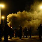 Protesters burn tires at the main entrance to Mercabarna, the biggest wholesale market, during a general strike in Barcelona, Spain, Wednesday, Nov. 14, 2012. Spain's main trade unions will stage a general strike, coinciding with similar work st...