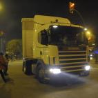 Protesters throw stones to a truck at the main entrance to Mercabarna, the biggest wholesale market, during a general strike in Barcelona, Spain, Wednesday, Nov. 14, 2012. Spain's main trade unions will stage a general strike, coinciding with si...