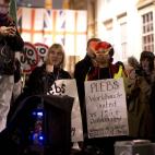Anti-austerity protesters listen to speakers as they take part in what they called 'the Plebs & PIIGS Banquet', a demonstration outside the Lord Mayor's Banquet in the City of London, Monday, Nov. 12, 2012. PIIGS is a reference to people from Po...