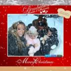 La cantante Mariah Carey posa junto a su esposo, Nick Cannon, y sus hijos, Moroccan y Monroe, en una estampa navideña donde las haya.