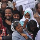 Ethiopians carry posters in Amharic reading "Meles We Love You" as they gather to mourn as the body of the late Prime Minister Meles Zenawi arrived in Addis Ababa, Ethiopia Wednesday, Aug. 22, 2012. Meles, Ethiopia's long-time ruler and a major ...