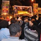 Ethiopians gather on the street of Addis Ababa early morning to mourn as the body of former Prime Minister Meles Zenawi arrived in the Addis Ababa , Ethiopia Wednesday, Aug. 22, 2012. Meles, Ethiopia's long-time ruler and a major U.S. counter-te...
