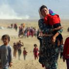 Agosto de 2014. Desplazados de la minor&iacute;a Yazidi huyen de la violencia del Estado Isl&aacute;mico en Sinjar, entre Siria e Irak.