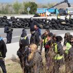 Spanish riot police clears a road blockade by Catalan separatists on AP-7 motorway linking Spain to neighbouring France, near Figueras on March 27, 2018. Spanish riot police broke up a blockade by Catalan separatists on major motorways in Catalo...