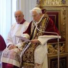 RECROP OF VAT114 - In this photo provided by the Vatican newspaper L'Osservatore Romano, Mons. Franco Comaldo, a pope aide, left, looks at Pope Benedict XVI as he reads a document in Latin where he announces his resignation, during a meeting of ...