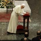 Pope Benedict XVI gets up after kneeling for a prayer during his visit at the Roman seminary, in Rome Friday, Feb. 8, 2013. (AP Photo/Gregorio Borgia)