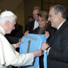 In this photo provided by Vatican paper L'Osservatore Romano, Pope Benedict XVI receives a Lazio soccer team's jersey from club's president Claudio Lotito, at the Vatican, Wednesday, Jan. 30, 2013. (AP Photo/L'Osservatore Romano)
