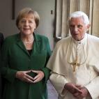 Pope Benedict XVI and German Chancellor Angela Merkel pose for a picture after an oecumenical service at the protestant monastery of St. Augustin in Erfurt, eastern Germany, on September 23, 2011, on the second day of the Pontiff's first state v...