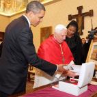 VATICAN CITY, VATICAN - JULY 10: US President Barack Obama (L) and First Lady Michelle Obama exchange gifts with Pope Benedict XVI in his library at the Vatican on July 10, 2009 in Vatican City, Vatican. Obama was meeting with The Pope for the ...