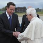 British Prime Minister David Cameron (L) bids farewell to Pope Benedict XVI at Birmingham International Airport, England, on September 19, 2010, after a four day visit to Britain by the Pope. Pope Benedict XVI flew out of Britain Sunday after an...
