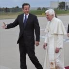 BIRMINGHAM, ENGLAND - SEPTEMBER 19: Pope Benedict XVI is escorted by PM David Cameron as heads to board his Alitalia jet to Italy on September 19, 2010 in Birmingham, England. Pope Benedict XVI has conducted the first state visit to the UK by a ...