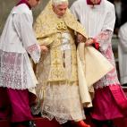 Pope Benedict XVI is helped by assistants as he celebrates the Vespers and Te Deum prayers in Saint Peter's Basilica at the Vatican on December 31, 2012. AFP PHOTO / ANDREAS SOLARO (Photo credit should read ANDREAS SOLARO/AFP/Getty Images)