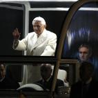 Pope Benedict XVI blesses the faithful as he arrives in St. Peter's square to bless the nativity scene at the Vatican, Saturday, Dec. 31, 2011. The Pontiff marked the end of 2011 with prayers of thanks and said humanity awaits the new year with ...