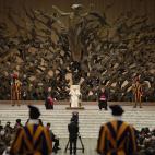 Pope Benedict XVI attends his weekly general audience at the Vatican, Wednesday, Dec. 22, 2010. In background is a bronze sculpture, the Resurrection, by artist Pericle Fazzini. (AP Photo/Alessandra Tarantino)
