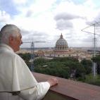 VATICAN CITY, Vatican: Pope Benedict XVI stands on the balcony and looks outside 20 April 2005 in the Vatican City. Newly elected Pope Benedict XVI made his first trip outside the Vatican, to his former apartment in Rome where he was greeted by...