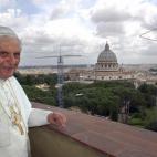 VATICAN CITY, Vatican: Pope Benedict XVI stands on a balcony at the Vatican 20 April 2005. Newly elected Pope Benedict XVI made his first trip outside the Vatican, to his former apartment in Rome where he was greeted by well-wishers. AFP PHOT...