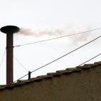 VATICAN CITY - APRIL 19: White smoke is seen from the roof of the Sistine Chapel indicating that the College of Cardinals have elected a new Pope on April 19, 2005 in Vatican City. Joseph Ratzinger (C) of Germany now known as Pope Benedict X...