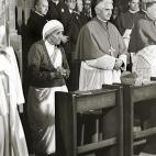 FREIBURG IM BREISGAU, GERMANY: A photo taken during the 85th German Catholics Days in Freiburg between 13 and 17 September 1978, shows the Cardinal Joseph Ratzinger (C) praying next to Mother Teresa. Ratzinger was elected the 265th pope of the ...