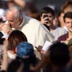 Pope Francis blesses a baby as he arrives for an audience with the participants at the Convention of Rome Diocese at St Peter's square on June 14, 2015 at the Vatican. AFP PHOTO / FILIPPO MONTEFORTE (Photo credit should read FILIPPO MONT...