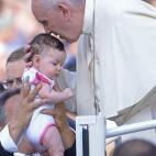 Pope Francis blesses a baby as he arrives for an audience with the participants at the Convention of Rome Diocese at St Peter's square on June 14, 2015 at the Vatican.  AFP PHOTO / FILIPPO MONTEFORTE        (Photo credit should read FILIPPO MONT...