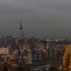 MADRID, SPAIN - 2018/12/11: A man seen enjoying the view through smog of Madrid skyline, where air pollution reaching dangerous levels for human health by the very high concentration of nitrogen dioxide. (Photo by John Milner/SOPA Images/LightRo...