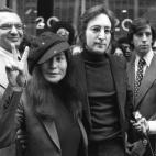 Former Beatle John Lennon and his wife, Yoko Ono, leave the U.S. Immigration hearing. Lennon was given 60 days to leave the country voluntarily or be deported as an undesirable alien at the hearings.