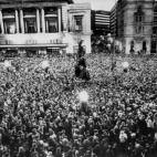 The scene when Liverpool paid tribute to one of its most famous sons, pop superstar John Lennon. Thousands gathered outside St George's City Hall for a concert to commemorate the former Beatle, who was shot dead in New York last week. More than ...