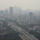 A general view of buildings as smog covers the capital city of Jakarta, Indonesia, July 29, 2019 in this photo taken by Antara Foto. Picture taken July 29, 2019 Antara Foto/Indrianto Eko Suwarso/ via REUTERS ATTENTION EDITORS - THIS IMAGE WAS P...
