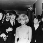 18th January 1964: The British pop band The Beatles, left to right, John Lennon (1940 - 1980), Paul McCartney, Ringo Starr and George Harrison (1943 - 2001), after their Paris show, with their co-star the French singer Sylvie Vartan. (Photo by...