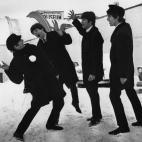 13th February 1964: The Beatles soon after their arrival in Washington, USA, playing in the snow outside the Coliseum where they were scheduled to perform before a sell-out audience. (Photo by Central Press/Getty Images)