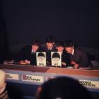 11th December 1963:  The Beatles pictured during their appearance on the music panel show, Juke Box Jury; pictured left to right are: John Lennon (1940 -1980), Paul McCartney, Ringo Starr and George Harrison (1943 - 2001).  (Photo by Hulton Arch...
