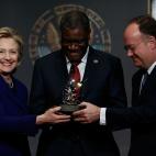 WASHINGTON, DC - FEBRUARY 25: Former U.S. Secretary of State Hillary Clinton (L) presents the Hillary Rodham Clinton Awards for Advancing Women in Peace and Security to Dr. Denis Mukwege (C), founder of Panzi Hospital in the Democratic Republic...