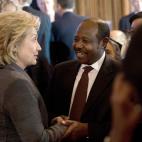 Former U.S. Secretary of State Hillary Clinton speaks with Rwandan 2011 Lantos Human Rights Prize laureate Paul Rusesabagina after receiving the 2013 Lantos Human Rights Prize during a ceremony on Capitol Hill in Washington on December 6, 2013. ...