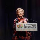NEW YORK, NY - DECEMBER 03: Global Impact Award Recipient Hillary Rodham Clinton speaks during Elizabeth Glaser Pediatric AIDS Foundation's Global Impact Award Gala Dinner Honoring Hillary Clinton at Best Buy Theater on December 3, 2013 in New ...