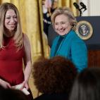 WASHINGTON, DC - NOVEMBER 20: Former U.S. Secretary of State Hillary Clinton (R) and her daughter Chelsea (L) greet guests before U.S. President Barack Obama awarded former U.S. President Bill Clinton the Presidential Medal of Freedom in the E...