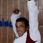 Opposition presidential candidate Henrique Capriles gestures from behind a voting booth as he casts his ballot in the presidential election in Caracas, Venezuela, Sunday, April 14, 2013. Capriles is running for president against Nicolas Maduro, ...