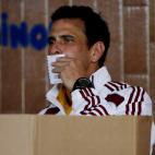 Opposition presidential candidate Henrique Capriles kisses his ballot as he votes in the presidential election in Caracas, Venezuela, Sunday, April 14, 2013. Capriles is running for president against Nicolas Maduro, the hand picked successor of ...