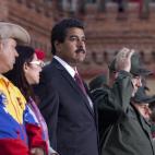 Venezuela's interim President Nicolas Maduro attends a ceremony marking the Day of the National Revolutionary Militia, also called Bolivarian militias, in Caracas, Venezuela, Saturday, April 13, 2013. The Bolivarian Militia is a force of volunte...