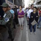 Residents wait in line outside a polling station during the presidential election in Caracas, Venezuela, early Sunday, April 14, 2013. Interim President Nicolas Maduro, who served as the late Hugo Chavez's foreign minister and vice president, is...