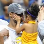 Kobe Bryant of the Los Angeles Lakers celebrates victory with his daughter following Game 5 of the NBA Finals against the Orlando Magic at Amway Arena on June 14, 2009 in Orlando, Florida. The Lakers won the National Basketball Association champ...